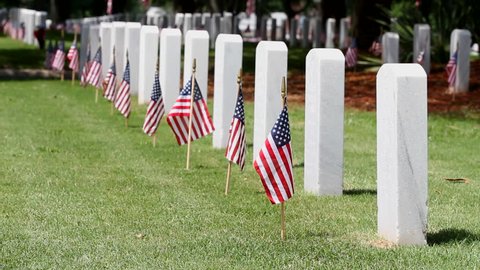 American flags on grave sites commemorate Memorial Day at a United States national cemetery.