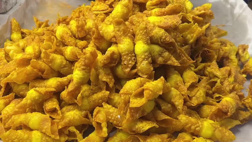 Video of crispy deep fried quail egg wonton Thai street snack