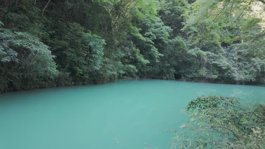 Panoramic landscape Zhangjiajie Turquoise River water in calm forest, China