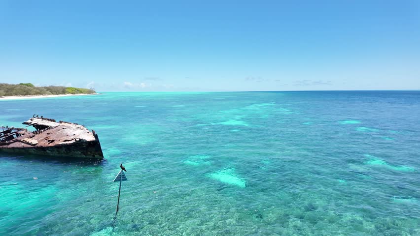 Shipwreck HMAS Protector used for an artificial reef and marine sanctuary for a protected coral cay on the Great Barrier Reef Queensland Australia
