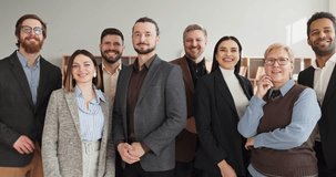 Team group people portrait in business office. Smiling happy colleagues pose after meeting, showing confidence, unity and cooperation in a bright modern workspace. Concept of teamwork and success. - Powered by Shutterstock - Get 15% off with code: PIKWIZARD15