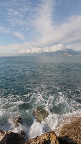 scenic coastal landscape with waves and stones