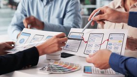 Diverse Business Team Discussing UI UX Design Wireframes For Mobile App In Meeting - Powered by Shutterstock - Get 15% off with code: PIKWIZARD15