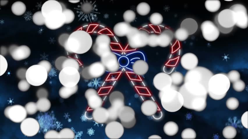 Animation of christmas neon candy canes flashing and snow falling on blue background. Christmas festivity, winter, tradition and celebration concept digitally generated video.