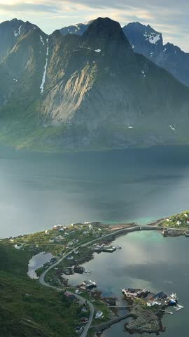 Reine: Stunning aerial perspective of a traditional fishing village surrounded by mountains in Lofoten, Norway