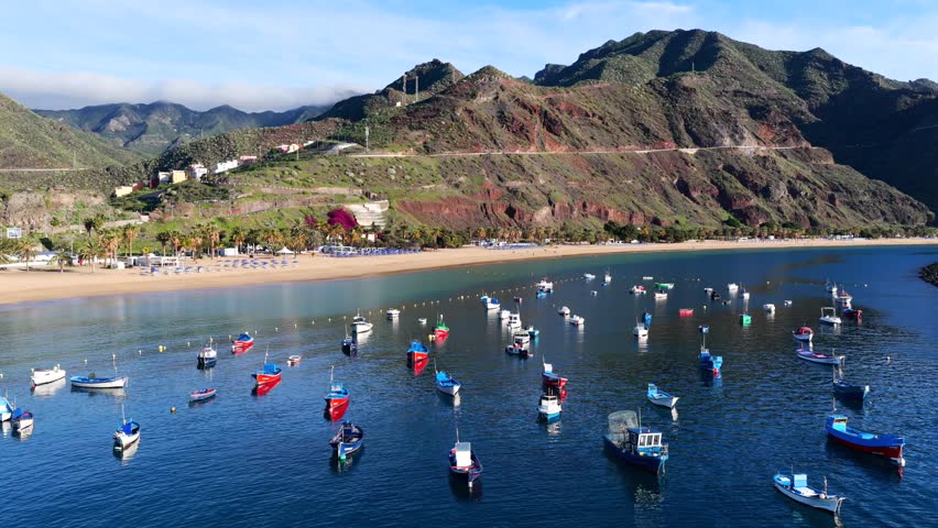Aerial panorama of Playa de Las Teresitas golden sand beach and turquoise ocean gradients in Tenerife Canary Islands