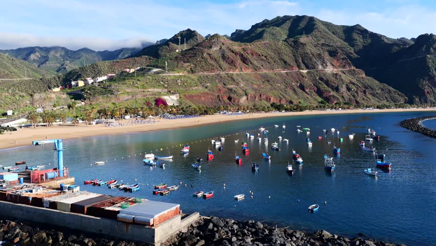Aerial panorama of Playa de Las Teresitas golden sand beach and turquoise ocean gradients in Tenerife Canary Islands