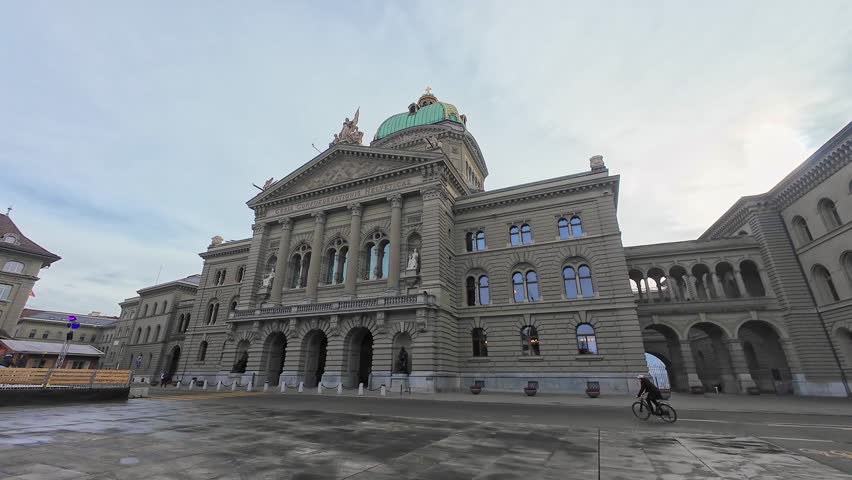 North Facade of Federal Palace of Switzerland on Cloudy Day and Bundesplatz. Bern, Switzerland. Moving Forward