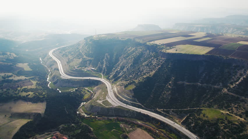 Aerial view of a winding road near Kula Fairy Chimneys Natural Monument in Turkey