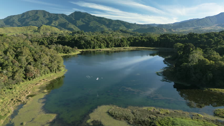 4K aerial drone footage of high-altitude lagoons in Volcan, Chiriquí, Panama. Scenic mountain lakes surrounded by tropical cloud forest and lush green hills. Natural freshwater ecosystem in one of the highest lagoon systems in Central America. Concept of biodiversity, conservation and pristine wilderness landscape, Volcan, Chiriqui, Panama - stock video