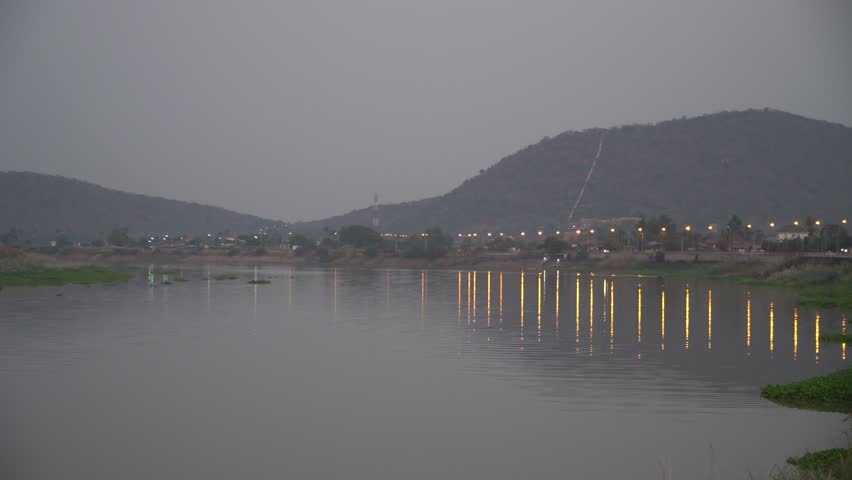 River with mountain views in the background during sunset.