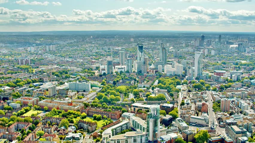 Aerial view of London cityscape showcasing modern architecture, green spaces, and urban planning, highlighting vibrant city life and scenic skyline.