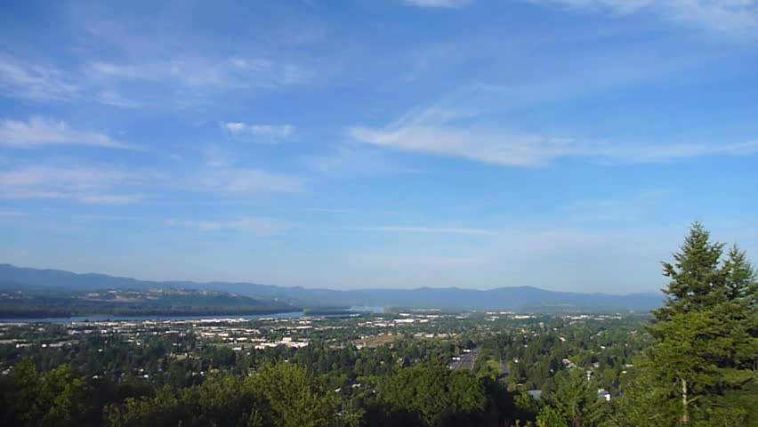 Time lapse over Portland, Oregon on blue sky day from high vantage point.