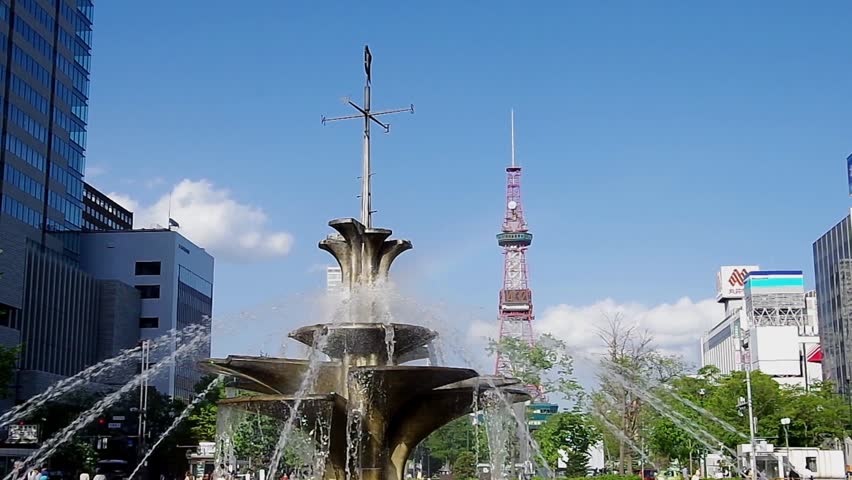 SAPPORO, JAPAN - MAY. 31 : The fountain and Sapporo TV Tower on May 31, 2013 in Sapporo, Hokkaido, japan.The Tower and fountain are located at Sapporo Odori Park.