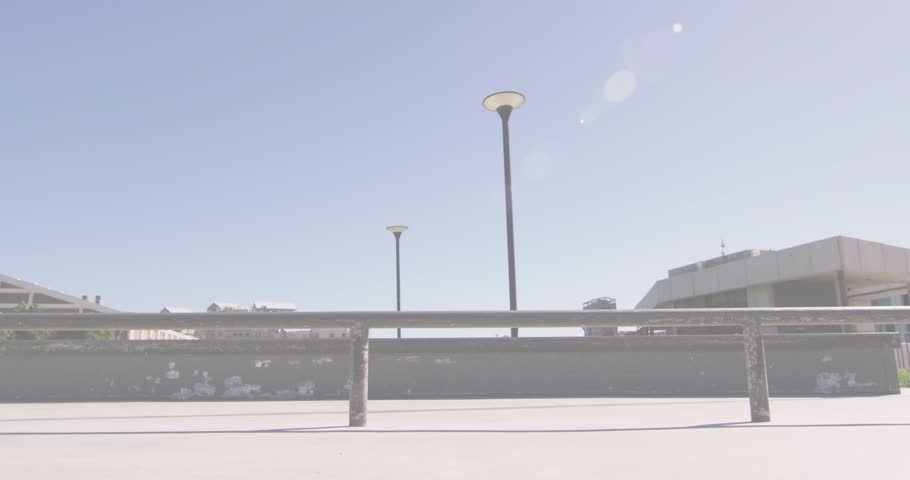 Animation of colourful spots over man skateboarding. global sport and digital interface concept digitally generated video.