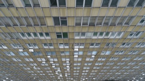 Drone Descending along Hospital Building Facade