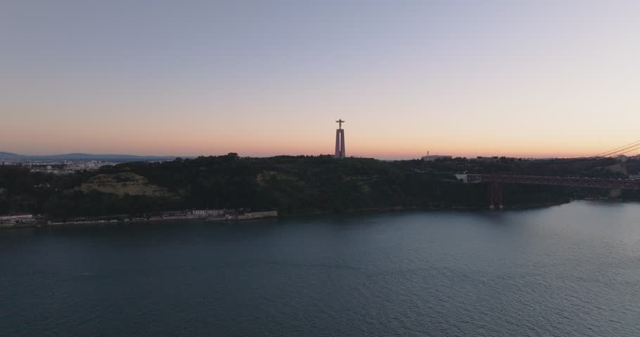Cristo rei Christ statue in Lisbon, Portugal. Sunset, dusk