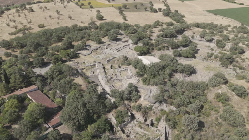 Tevfikiye, Turkey. Imposing defensive walls, towers and the Scaean Gate of the ancient city of Troy, Canakkale. Aerial view. D-Log M. Aerial View, Departure of the camera, MasterShots