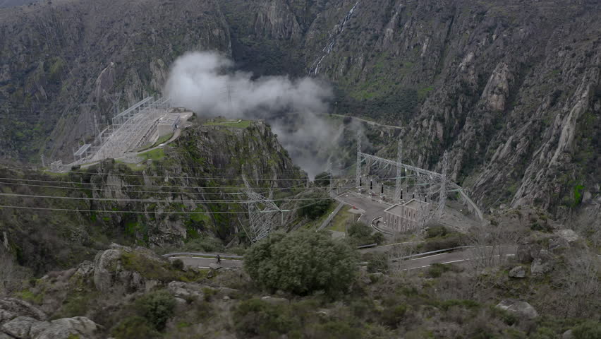 Drone view of Aldeadávila hydroelectric power plant in extreme spillway release Spain