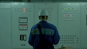 Electrical engineer using digital tablet to inspect equipment at factory electrical substation. Power plant maintenance and energy industry concept. - Powered by Shutterstock - Get 15% off with code: PIKWIZARD15
