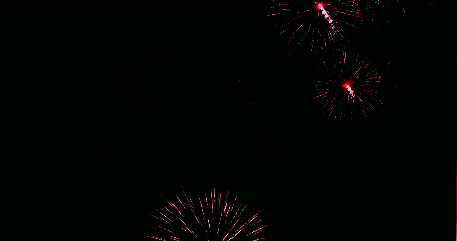 A vibrant fireworks display culminates in a celebratory spectacle of fireworks illuminating the night sky.