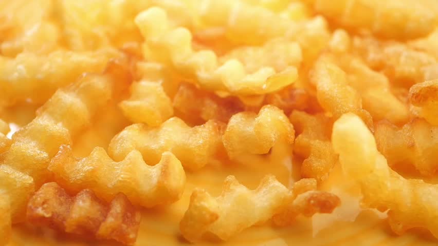  dropping crispy fries in a bowl 