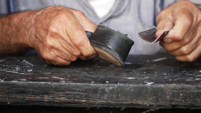 Shoe repair by a craftsman