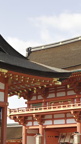 Traditional japanese temple building and blooming pink cherry blossoms, capturing the essence of spring in japan