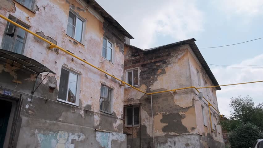 Close-up of fallen plaster from an old house, depicting rustic life and aged architecture, ideal for heritage, construction, or rural lifestyle visuals.