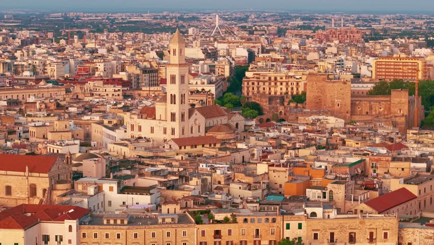 Aerial view of Bari Vecchia at sunrise. Historic old town architecture, Adriatic coast, and the Basilica of Saint Nicholas in the soft morning light of Puglia, Italy