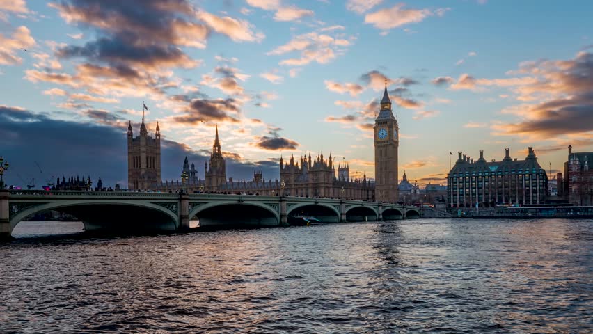Sunset to night time lapse view of the Westminster Bridge with Elizabeth Tower, so called Big Ben, London, with street and river traffic