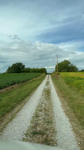  A road going through Farm land near Evansville, IL on a fall sunny day.