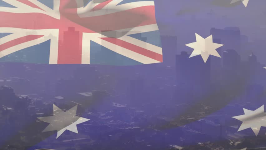 Projector pulsing and flag rippling over skyline, Union Jack and stars shifting, revealing skyline. Ensign, banner, australia, australian, canton, commonwealth, blue
