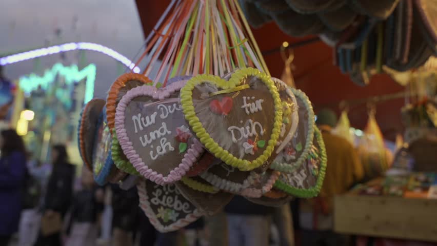 Munich, Germany. Sale of heart shaped gingerbread at Oktoberfest beer festival at Theresienwiese in Munchen, Bayern, Deutschland. Verkauf von Lebkuchen in Herzform auf Oktoberfest. 