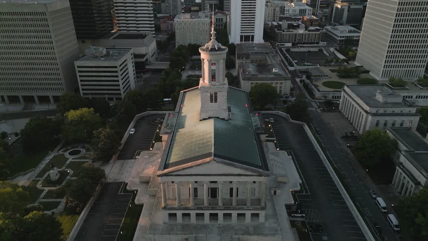 Nashville, Tennessee, USA downtown city skyline with the Tennessee State Capitol at dawn.