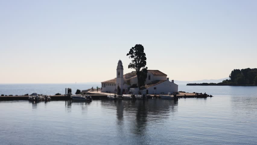 Holy Monastery of Panagia Vlacherna, Kanoni, Corfu Island, Kerkyra, Greece, with Ionian sea and Pontikonissi island, beautiful summer sunny day
