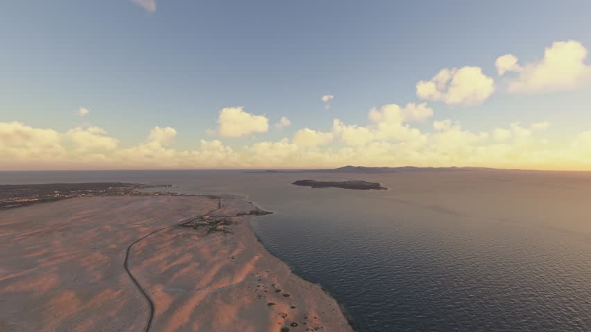 3D - Sunrise aerial shot Beaches of Corralejo in Parque Natural de Corralejo. La Oliva. Fuerteventura. Spain