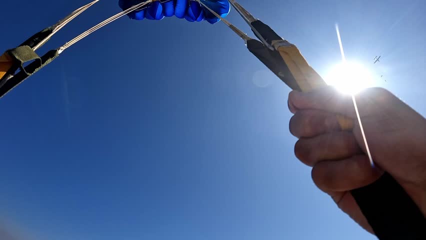 A parachute unfolding in the sky. Skydiving.