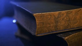 Pile of old vintage books on a table in a dark room, perfect for education, literature, history, reading, and nostalgic visuals. - Powered by Shutterstock - Get 15% off with code: PIKWIZARD15