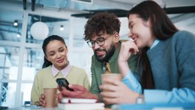 Female coworkers sitting with takeaway coffee cups. Group colleagues laughing during short pause. Women enjoying friendly conversation. Office tea m relaxing together in contemporary workspace. - Powered by Shutterstock - Get 15% off with code: PIKWIZARD15