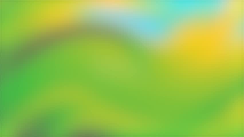 A blurred image featuring a mix of green and yellow hues with a glimpse of blue sky, creating a vibrant and abstract background.