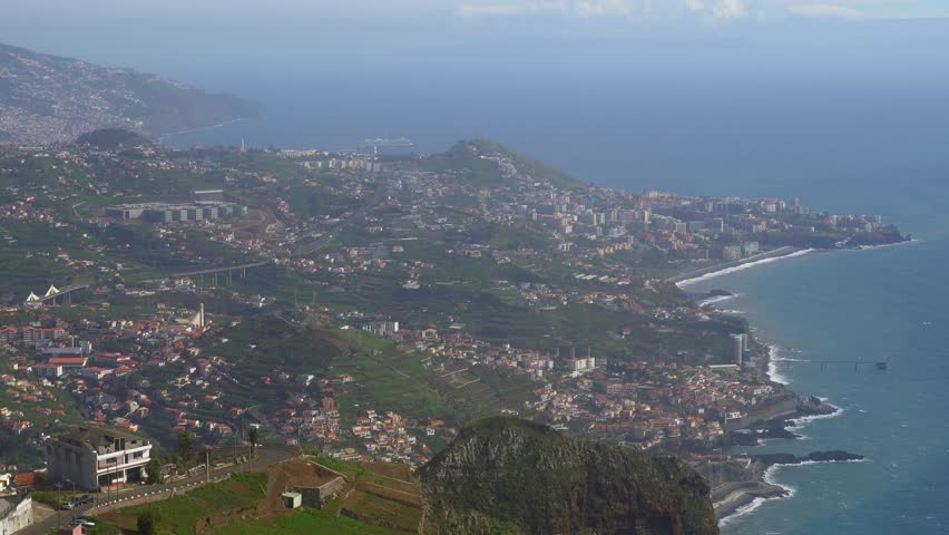 Panoramic aerial view of Funchal coastline and Atlantic ocean.