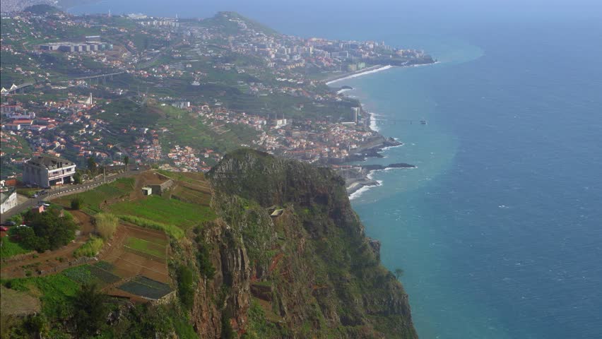 Panoramic aerial view of Funchal coastline and Atlantic ocean.