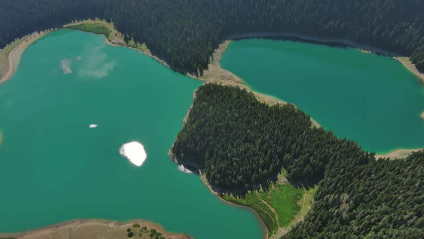Aerial around view of Black Lake in mountain Durmitor park at summer, Montenegro, 4k