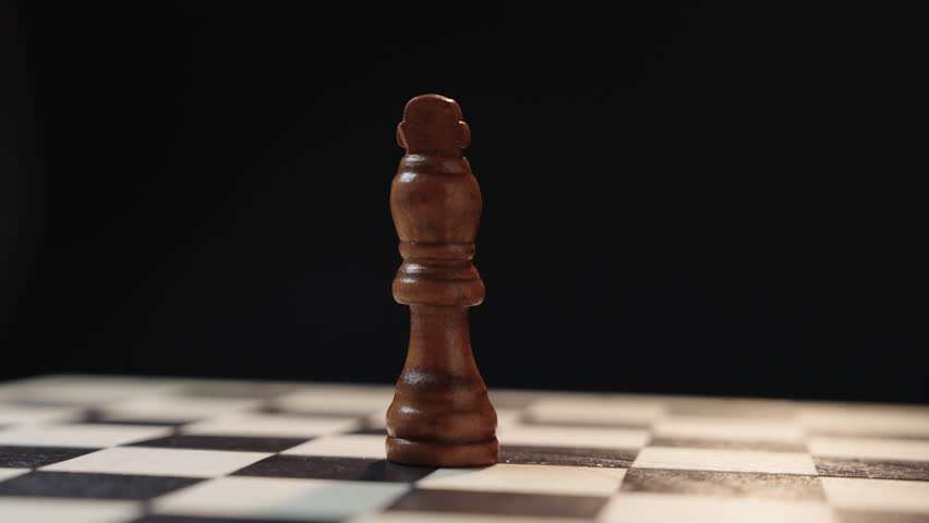 Cinematic chess scene with circular camera movement as one king enters and knocks down another representing business competition leadership change takeover strategy and power transition concept