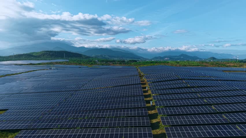 Big farm of solar panels installed in field, Aerial top view. Concept innovation ecology energy generator for environment.