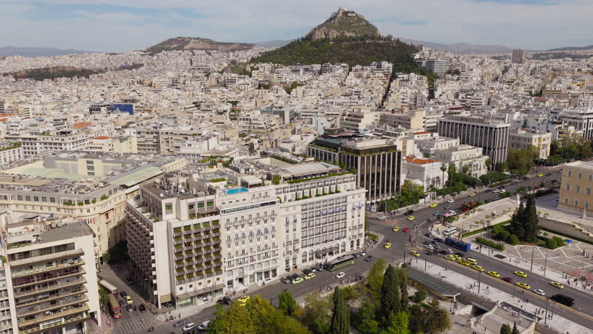 Syntagma square, Mount Lycabettus and Hellenic Parliament in Athens Greece during the day time