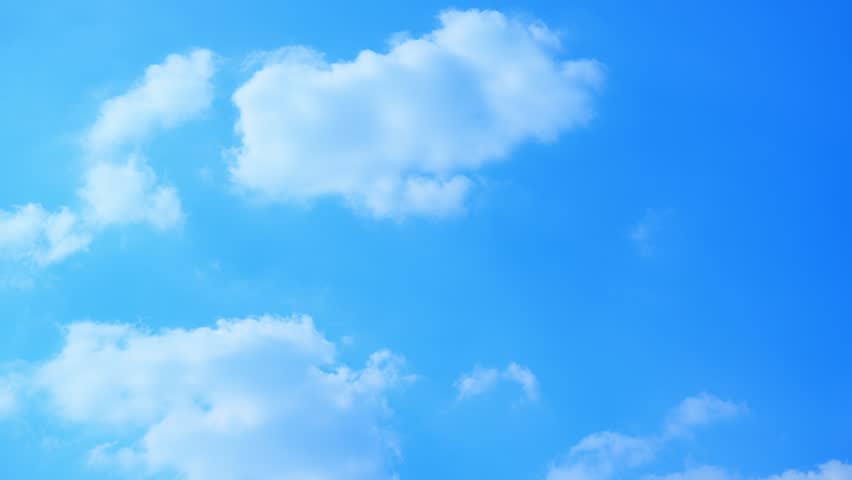 A blue sky timelapse video featuring soft cumulus clouds drifting across a bright atmosphere, capturing dynamic cloud movement and natural sky transitions under clear daylight conditions.
