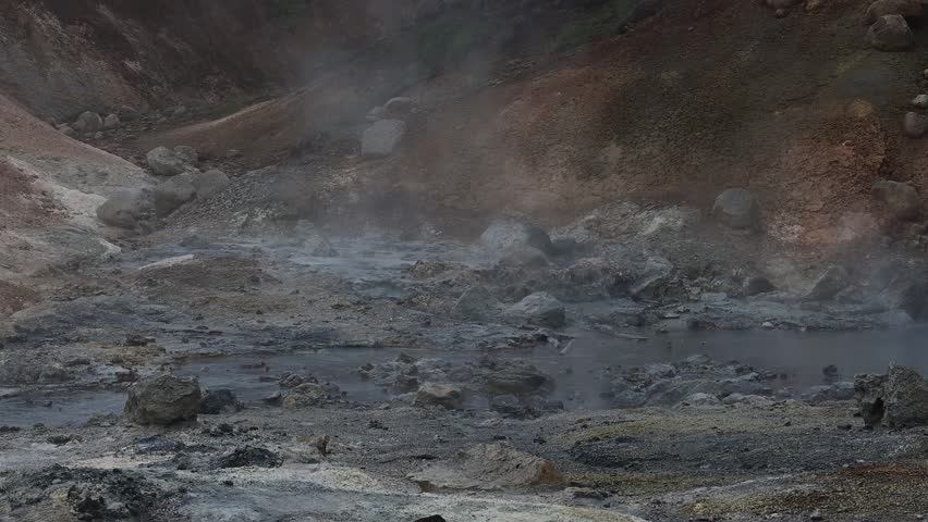 Bubbling mud pots and geothermal steam vents in Seltun volcanic area, Krysuvik, Iceland