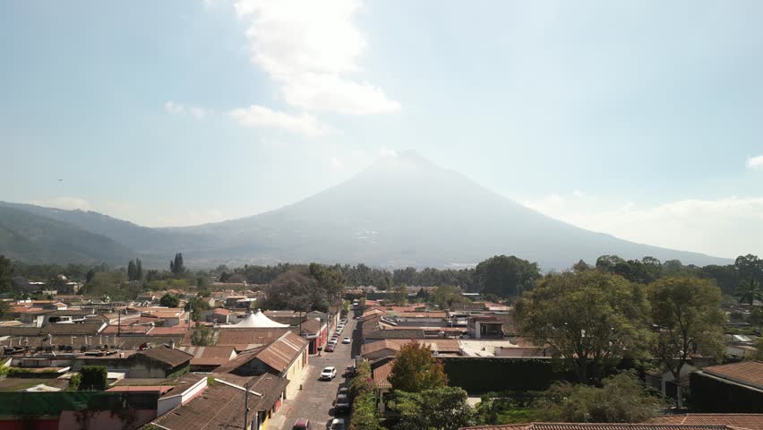 Aerial of downtown Antigua Guatemala with volcano view of Volcan Agua
